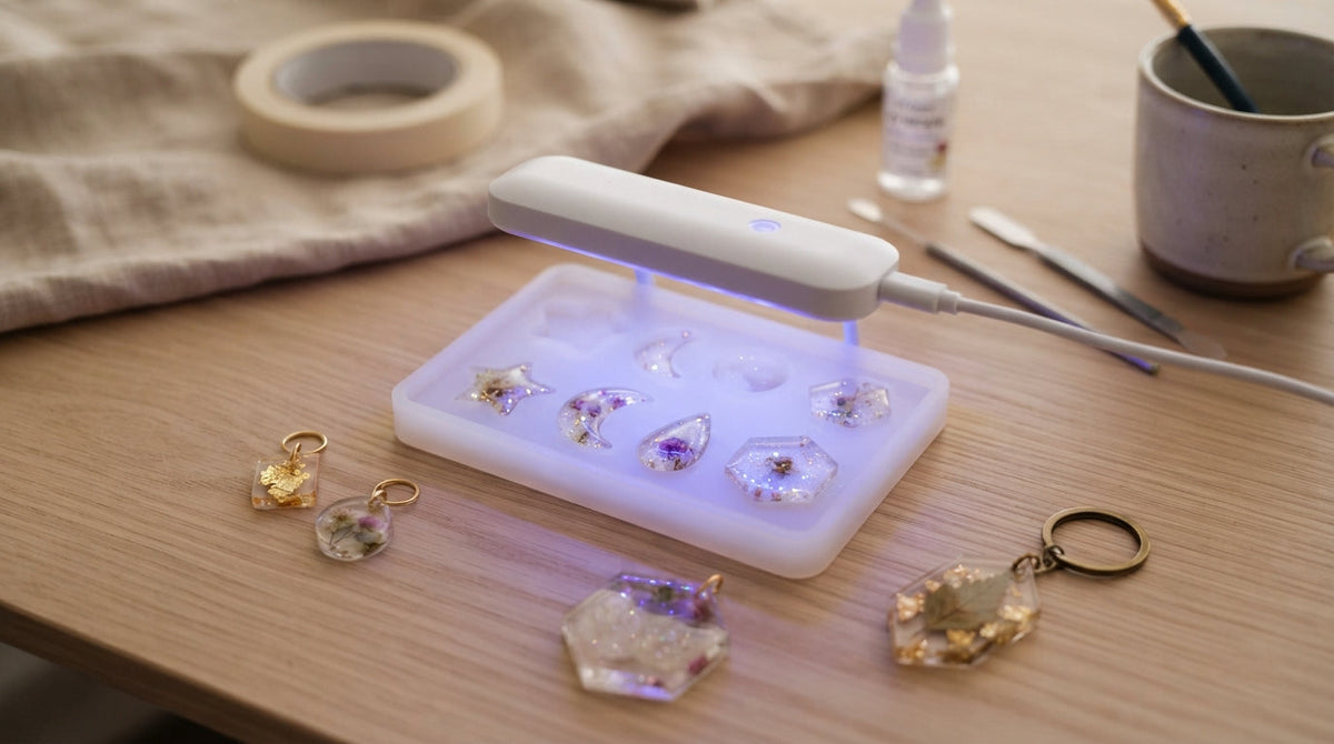 Clear UV resin curing under a UV lamp in a frosted silicone mold