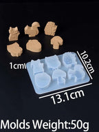 A set of six light tan silicone molds shaped like animals and objects, shown with a translucent blue tray and overlaid dimension labels (13.1cm, 10.