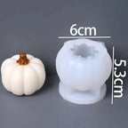 A small white pumpkin-shaped mold or candle base with a brown stem next to a translucent white silicone mold, shown on a gray background with overlaid dimensions (6cm, 5.3cm) and text reading 'Molds Weight:58g'.