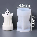 A white ghost-shaped candle next to a translucent white silicone mold, with overlaid dimension labels showing 4.8 cm and 7.